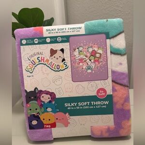 New Squishmallow soft 40x50 inch throw. This fluffy pastel colored throw is nice